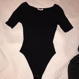 Cute fitted 3/4 sleeve low cut boat neck bodysuit